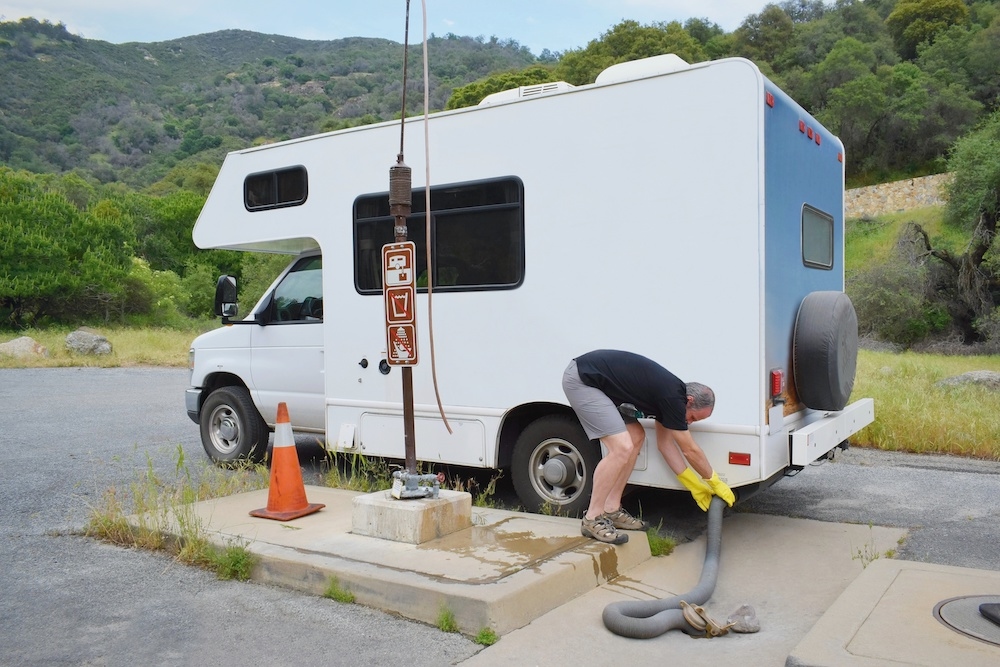 RV-At-Dump-Station-With-Sewer-Hose-Hooked-Up-Credit-to-Deposit-Photos.jpg