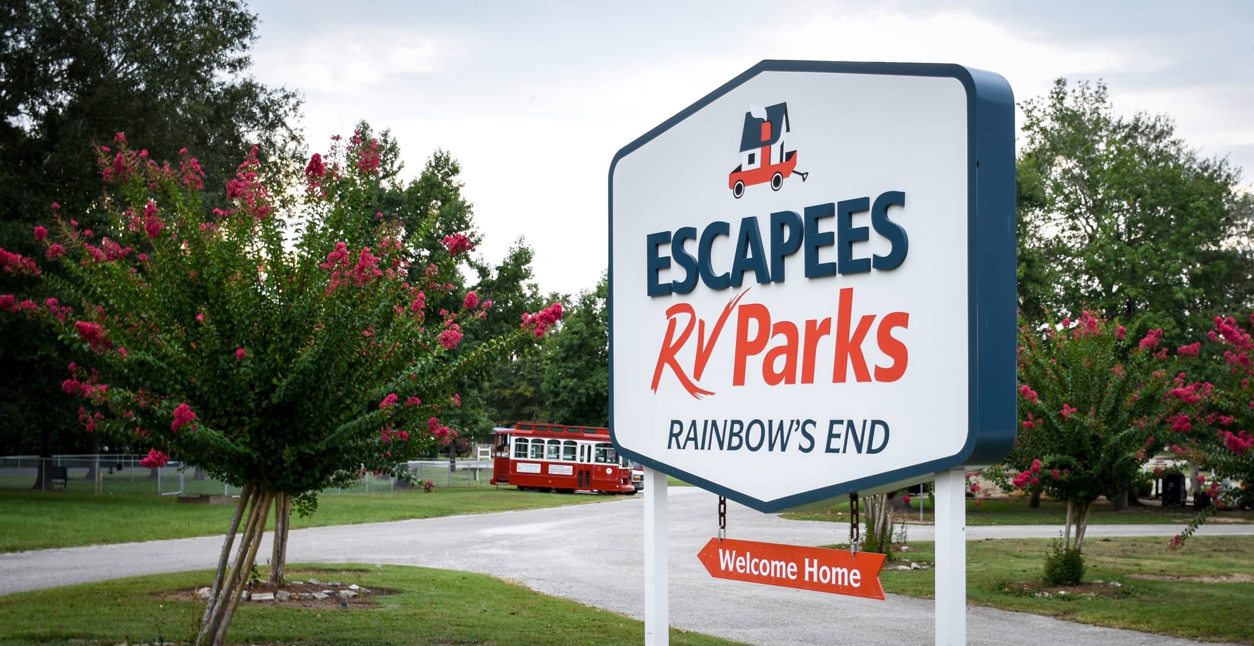 New sign on display at Rainbow's End RV Park, advertising Escapees RV Parks and welcoming guests home.