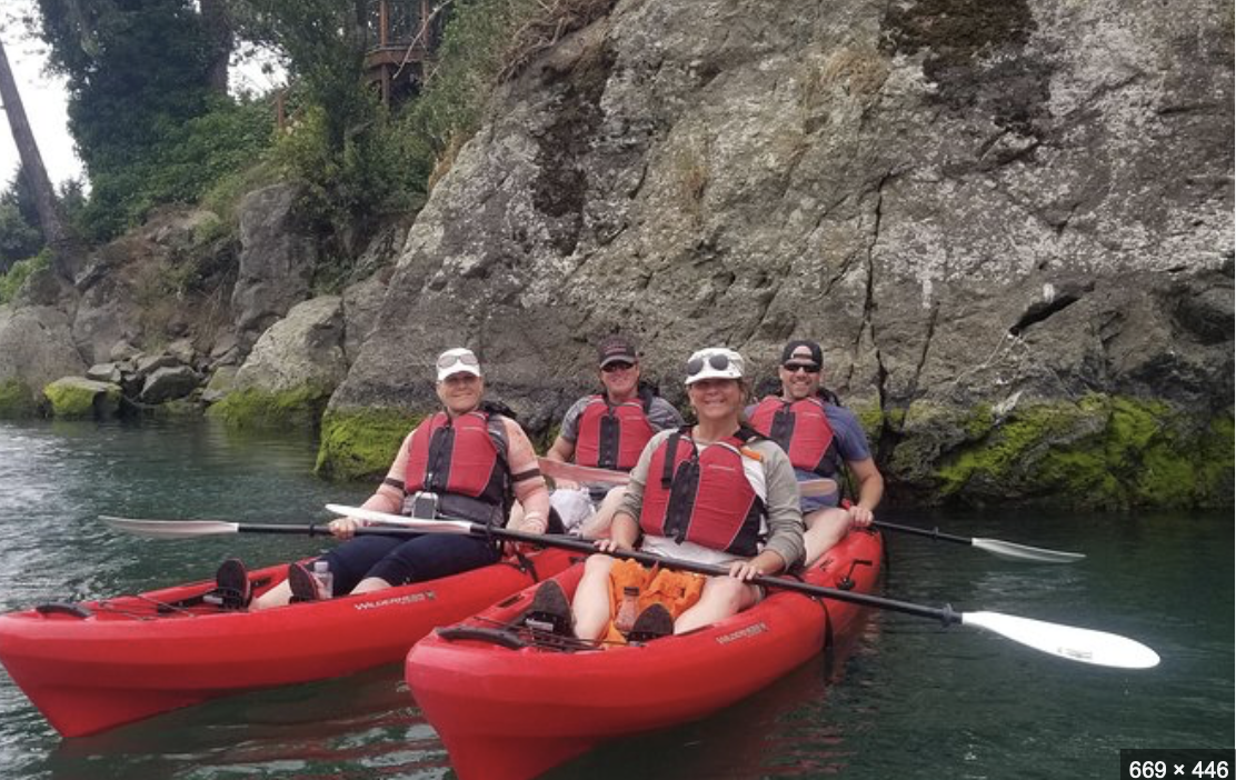 group kayaking down the chetco river in Oregon