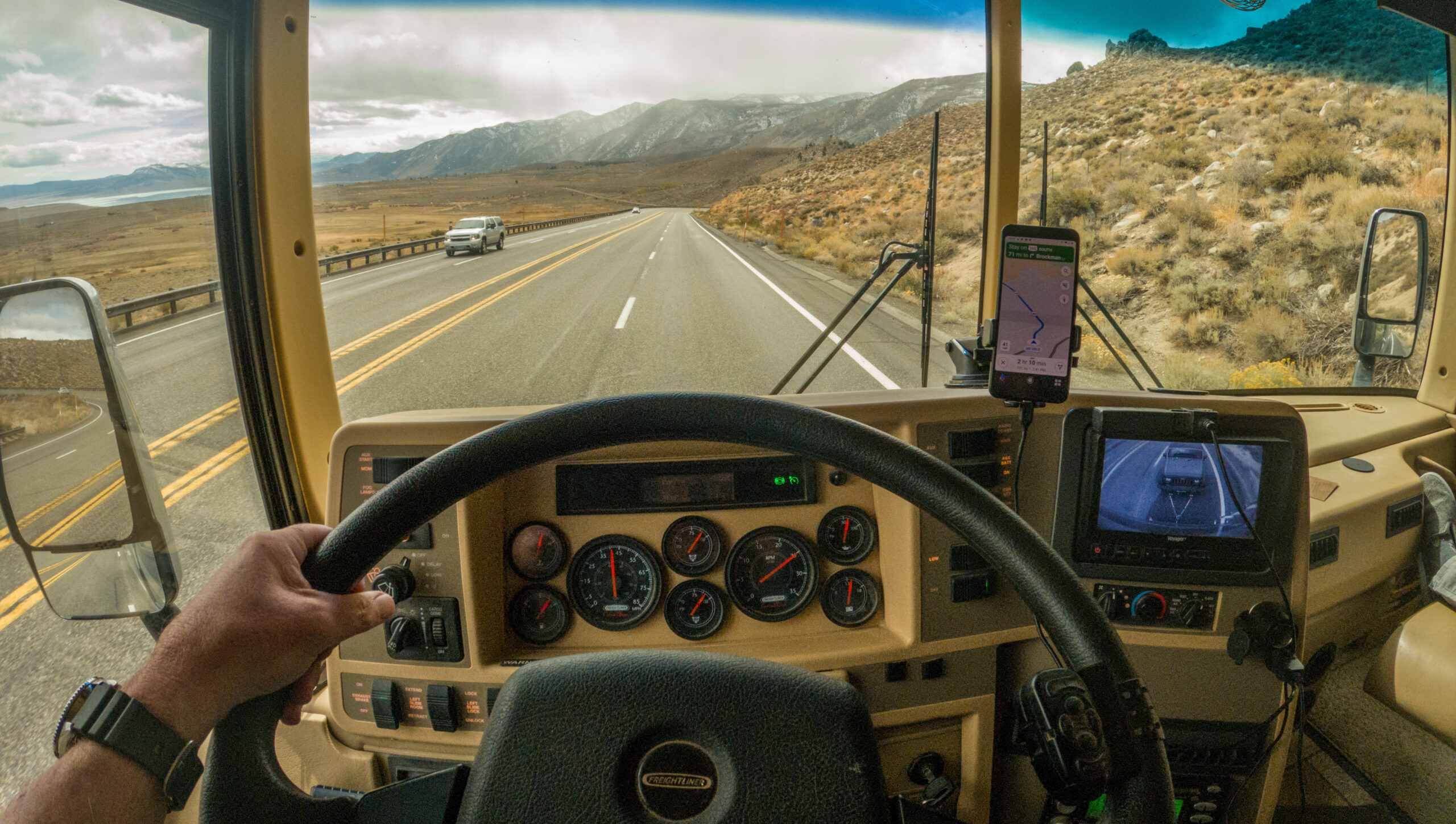 A view of Hwy 395 from the dashboard of a motorhome