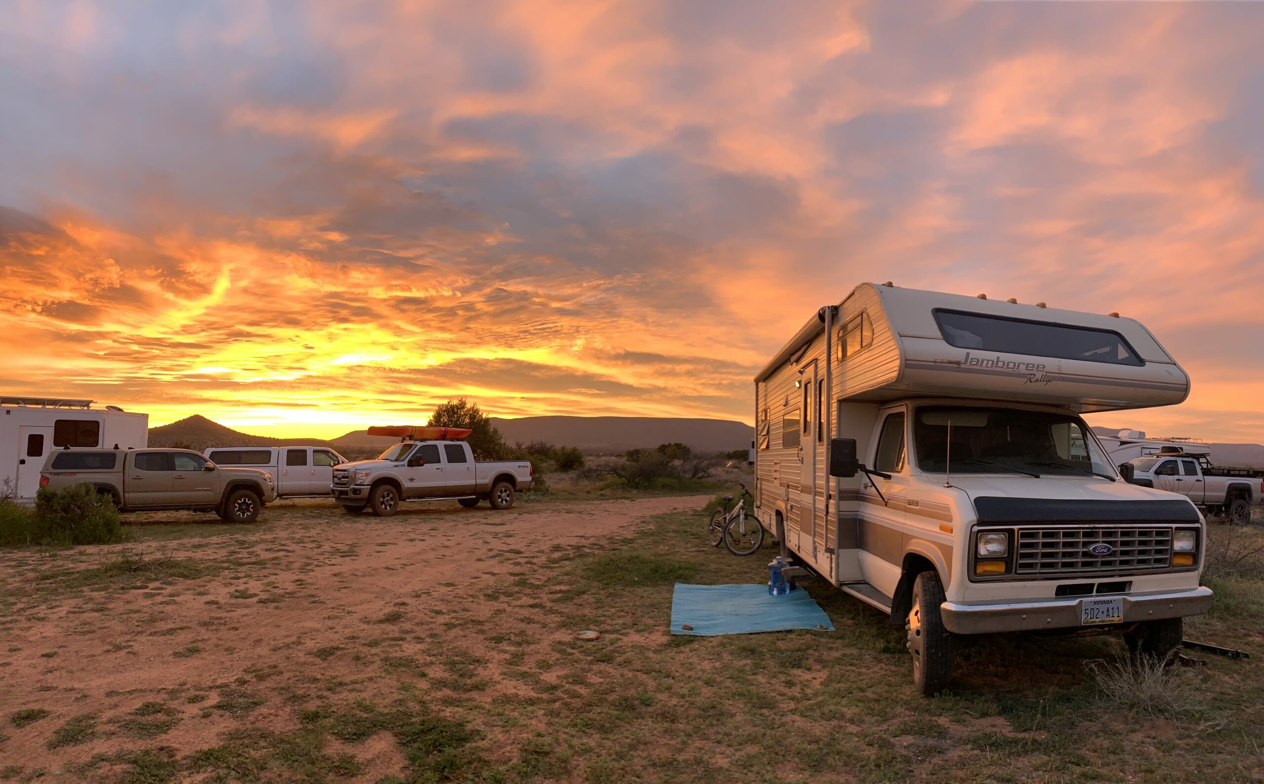 RV in desert at sunset