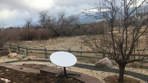 Satellite internet dish in field